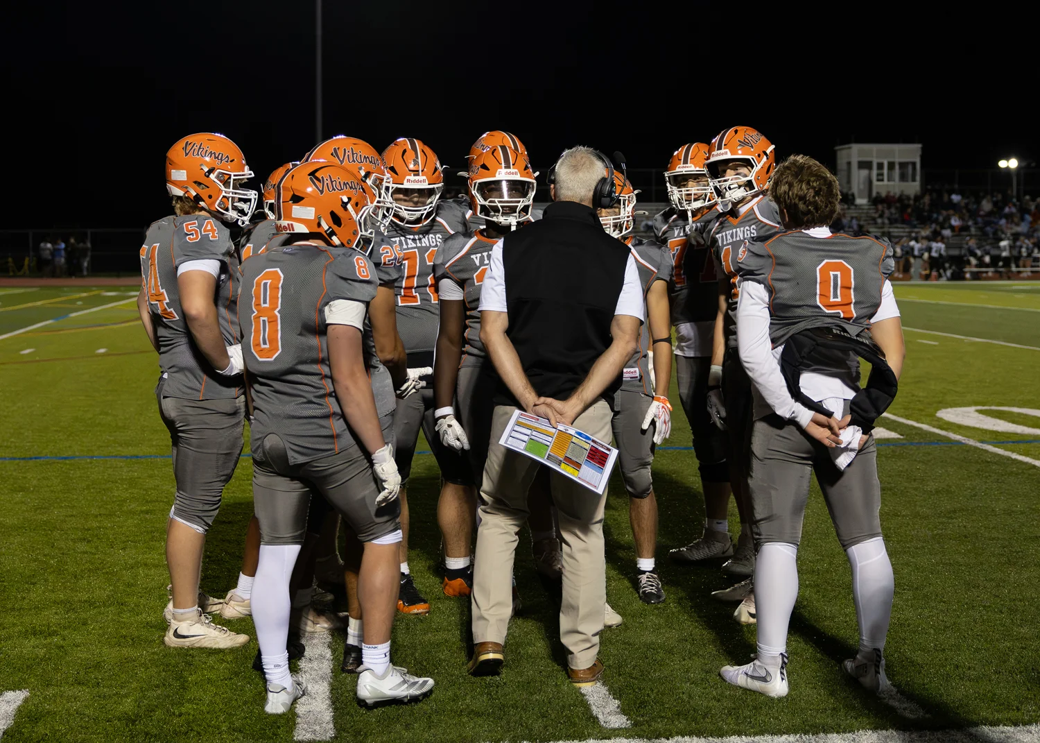 Coach talking to the team in the huddle